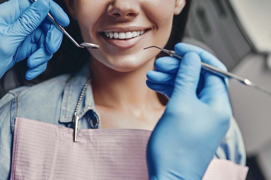 Individual Dental Insurance - Woman Getting Her Teeth Cleaned